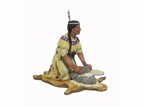 Woman mashing corn w/stone