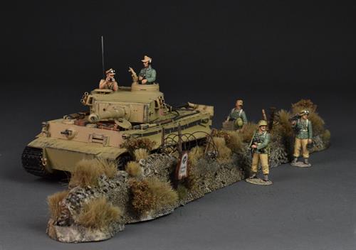 Vold med tør vegetation, minefelt og pigtråd